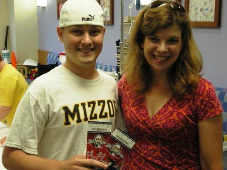 Andy Cook receives his All-Star Game tickets from Julie Hantmann