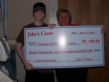 Jake Franzel presents his check to Judy Ciapciak, Executive Director